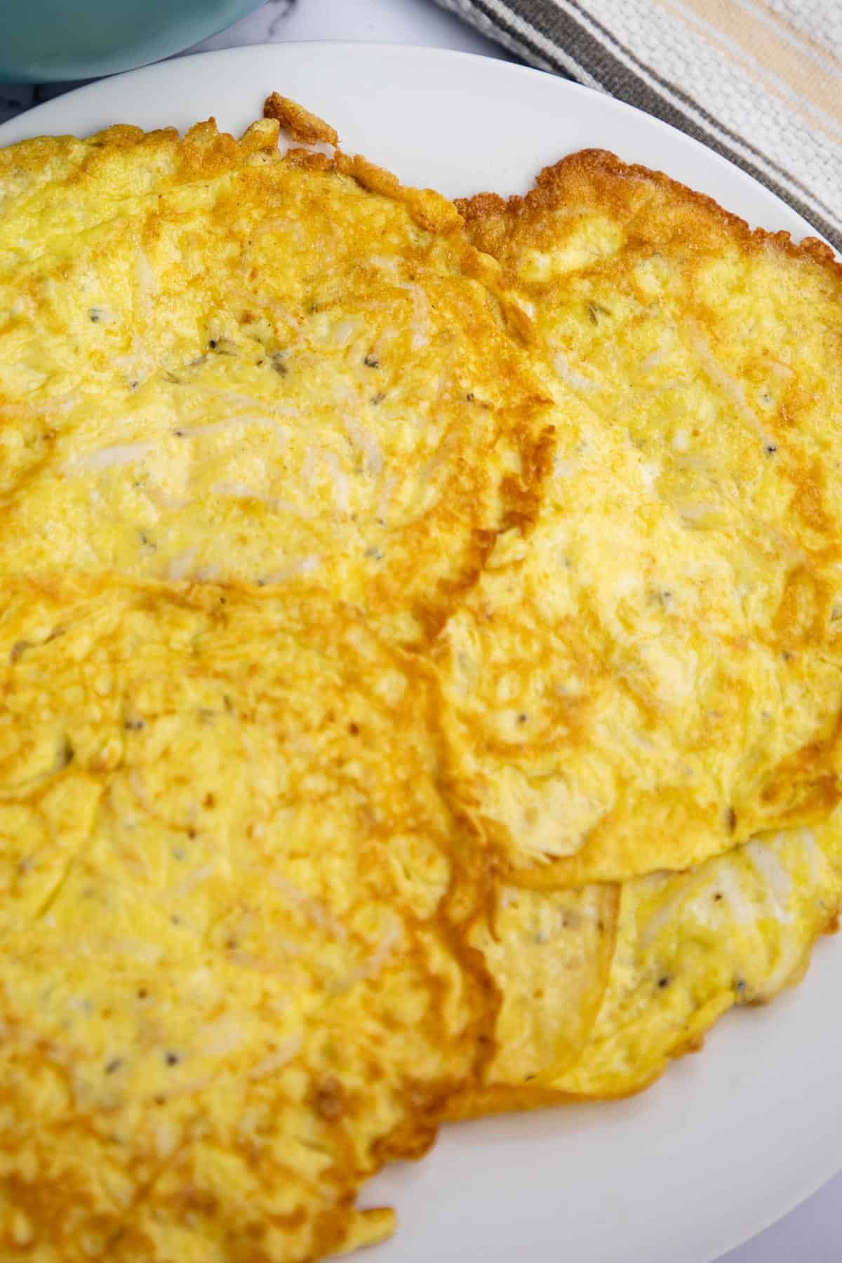 silverfish omelet on white plate