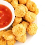 cooked chicken nuggets with sauce.